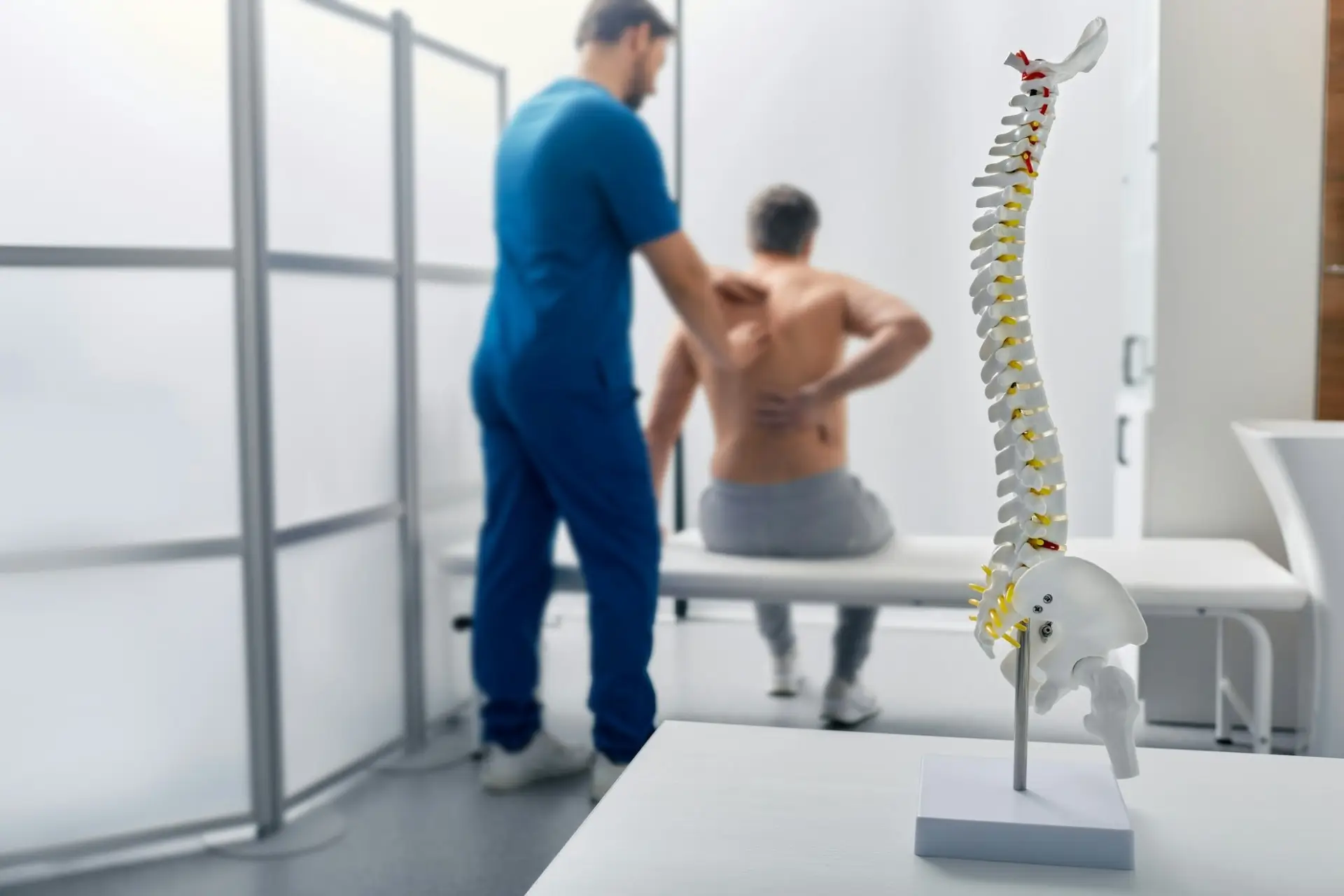 Chiropractor Henderson helping patient with lower back pain after auto accident injury, personal injury and neck pain care